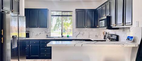 Coffee/tea maker, fridge, microwave, oven