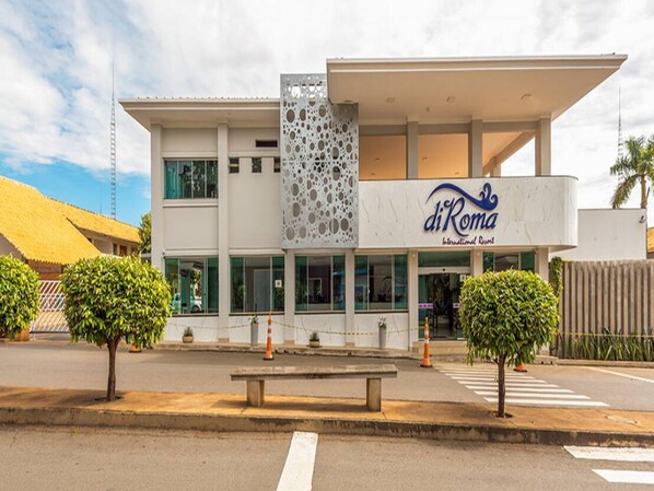 A modern building with a sign reading "diRoma International Resort".