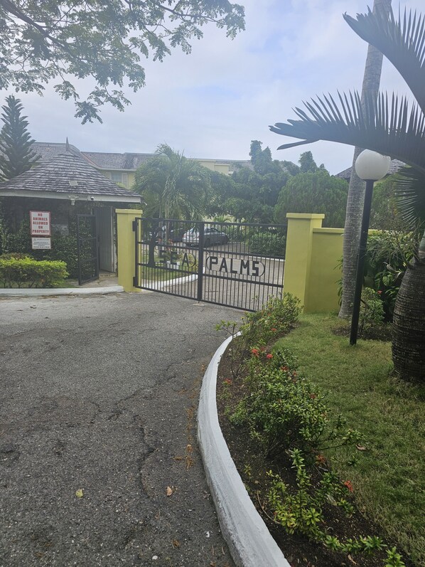A gated entrance with a sign reading "No Animals Allowed on Property." - Apartment E6 (Tower Isle)