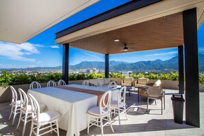 Enjoy meals al fresco with a view of the surrounding mountains and cityscape.