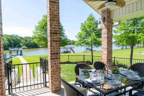 Pelican Estates Lake house at Cedar Creek Lake on wide cove in gated community.