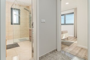 Shower, hair dryer, towels, soap
