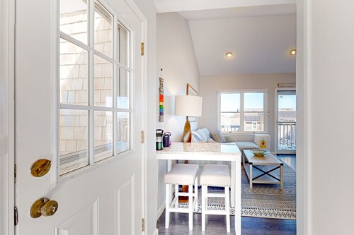 Two-story condo with ocean views, parking, & private balcony