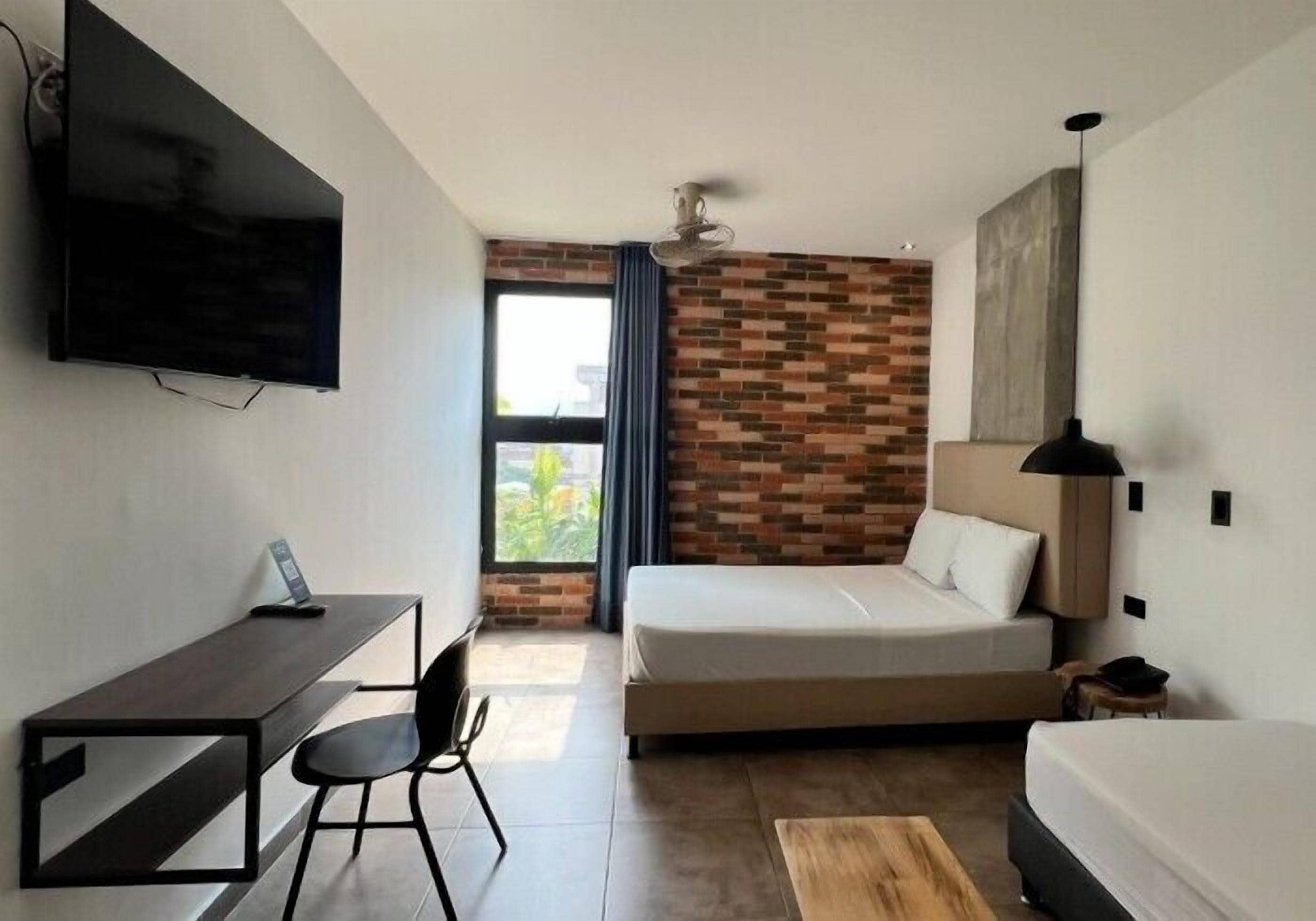 Desk, laptop workspace, free WiFi, bed sheets
