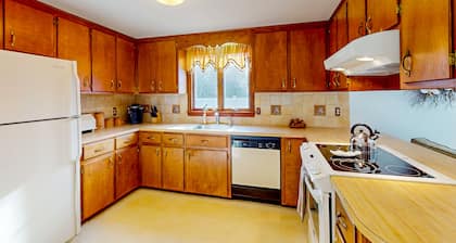 Single-story home with fenced yard, deck & great location near town/beaches
