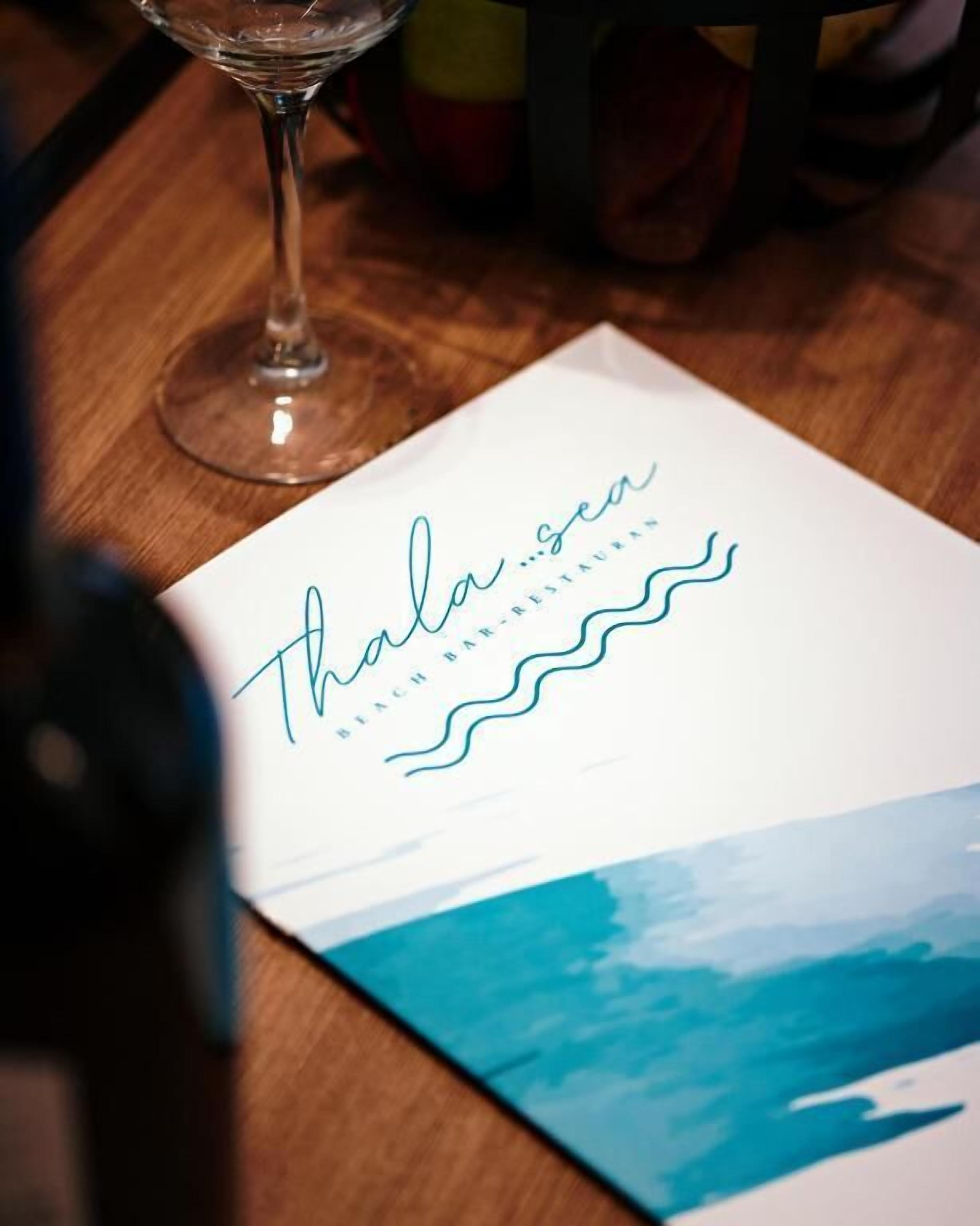A menu for Thala Sea Bar-restaurant with a simple design.