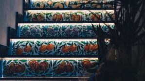 A staircase with patterned tiles featuring fruit designs. - macchiamediterrane (Castellammare del Golfo)
