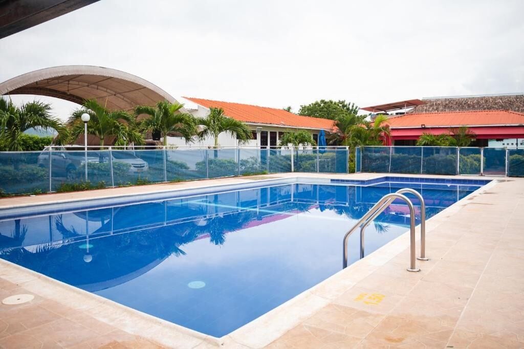 Outdoor pool, open 9:00 AM to 6:00 PM, pool umbrellas