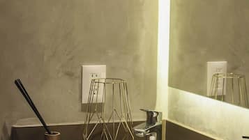 Shower, hair dryer, towels, toilet paper