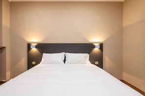 Premium bedding, down duvets, pillow-top beds, soundproofing