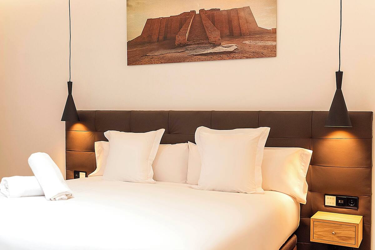 Junior Double Room, Non Smoking | In-room safe, desk, laptop workspace, blackout drapes