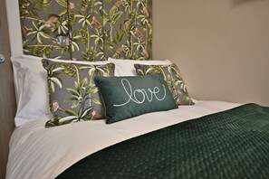 1 bedroom, desk, iron/ironing board, travel crib