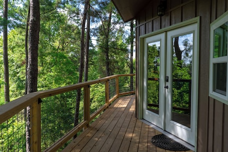 Terrace/patio. Escape to the Canopy: Enchanting Treehouse Retreat in the Heart of Nature