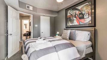 1 bedroom, desk, iron/ironing board, travel crib