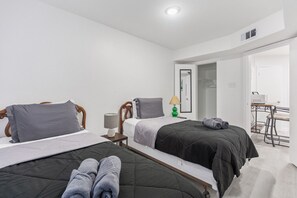 1 bedroom, desk, iron/ironing board, travel crib