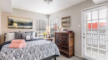 1 bedroom, desk, iron/ironing board, travel crib