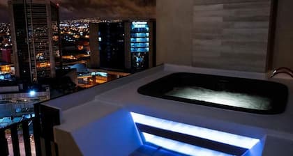 Cozy penthouse with a hot tub and an amazing view. 15 minutes from the airport.