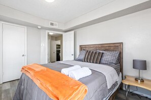 1 bedroom, desk, iron/ironing board, travel crib