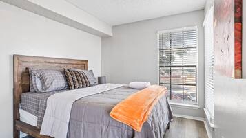 1 bedroom, desk, iron/ironing board, travel crib