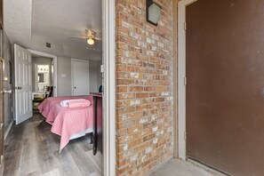 1 bedroom, desk, iron/ironing board, travel crib