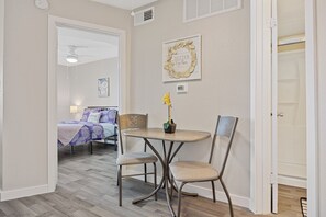 1 bedroom, desk, iron/ironing board, travel crib