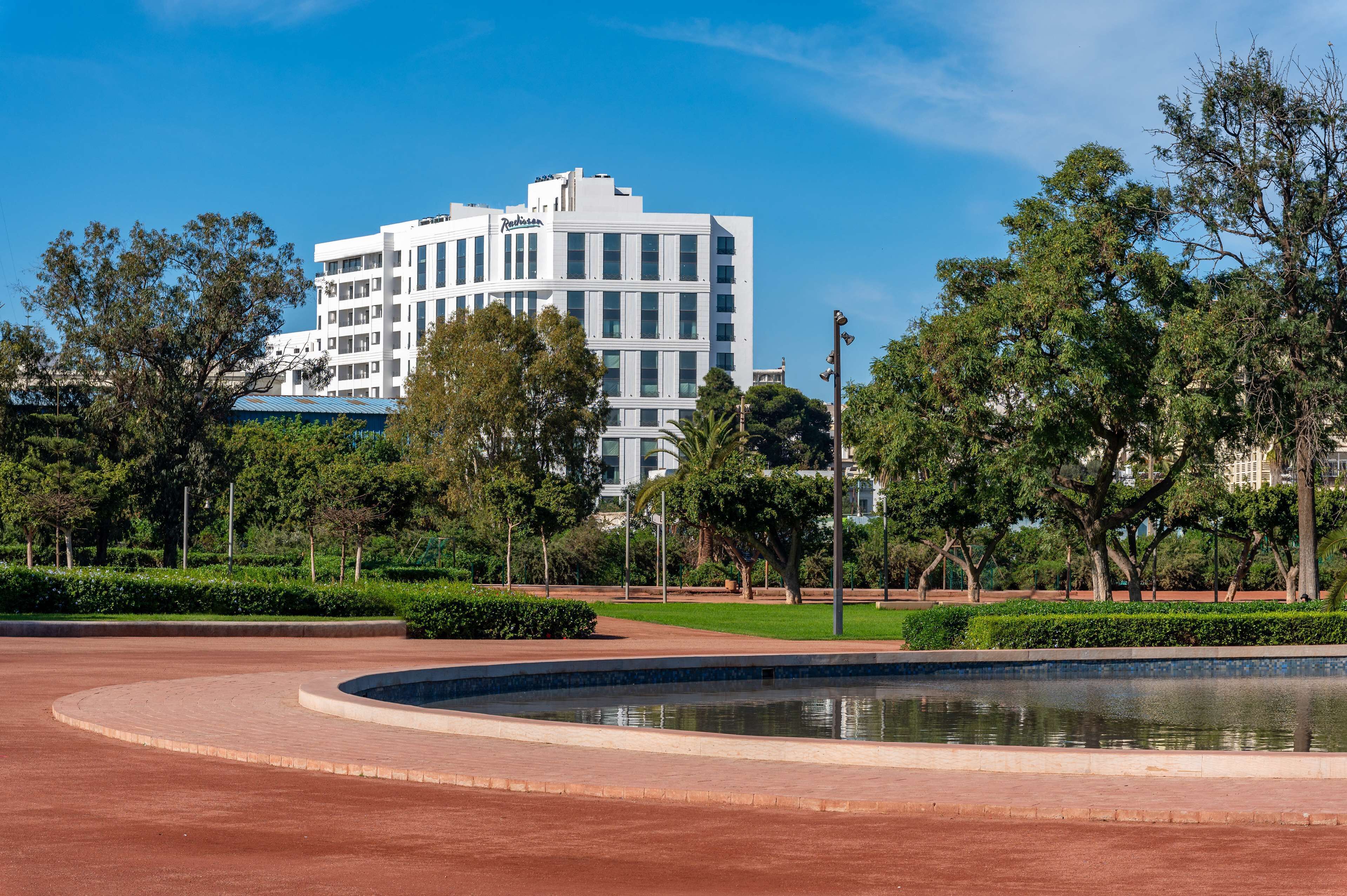 A modern building with a flat roof and a sign that reads "Radisson."