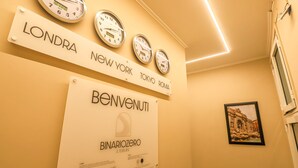 A wall with clocks and signs indicating different cities. - Binaro 0 a Termini (Rome)