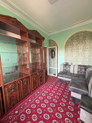 Traditional Triple Room | Living area | Flat-screen TV