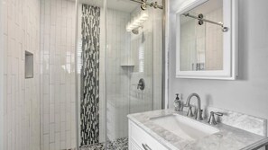 Shower, hair dryer, towels, shampoo