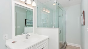 Shower, hair dryer, towels, shampoo