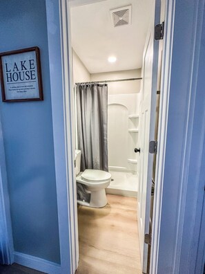 Shower, hair dryer, towels, toilet paper