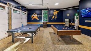 A billiards room with two tables, a pool table, and a foosball table. - Mountain Hideaway 8 acres - 5 Bedrooms + Hot Tub (Hendersonville)