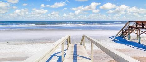 On the beach, sun loungers, beach towels