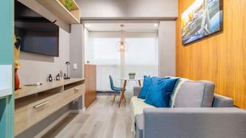 Family Double Room | Living area | 32-inch TV with digital channels