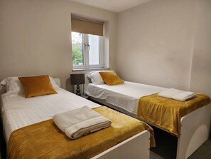Apartamento premium | 2 quartos, Wi-Fi de cortesia, roupa de cama