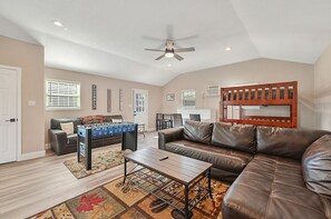 Smart TV, fireplace, table football, books