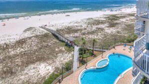 A beachfront hotel with a swimming pool, beach access, and a view of the ocean. - Spanish Key 703 (Pensacola)