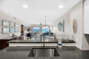 Enjoy ocean views from the kitchen window, where a large sink and oven await.