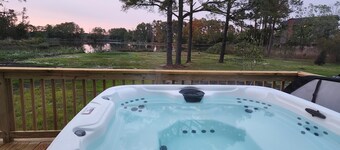 Secluded waterfront getaway with hot tub,fire pit, and private dock. 