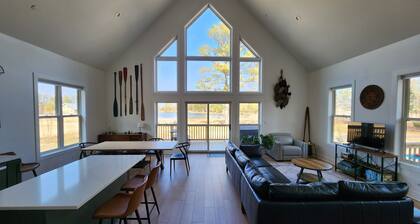 Secluded waterfront getaway with hot tub,fire pit, and private dock.