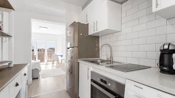 Fridge, microwave, stovetop, coffee/tea maker