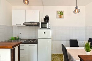 Fridge, stovetop, cookware/dishes/utensils