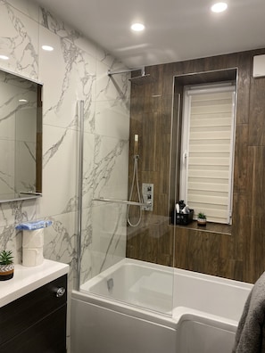 Shower, hair dryer, towels, soap