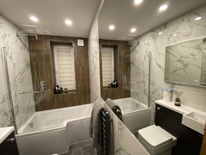 Shower, hair dryer, towels, soap