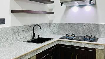Fridge, stovetop, electric kettle, toaster