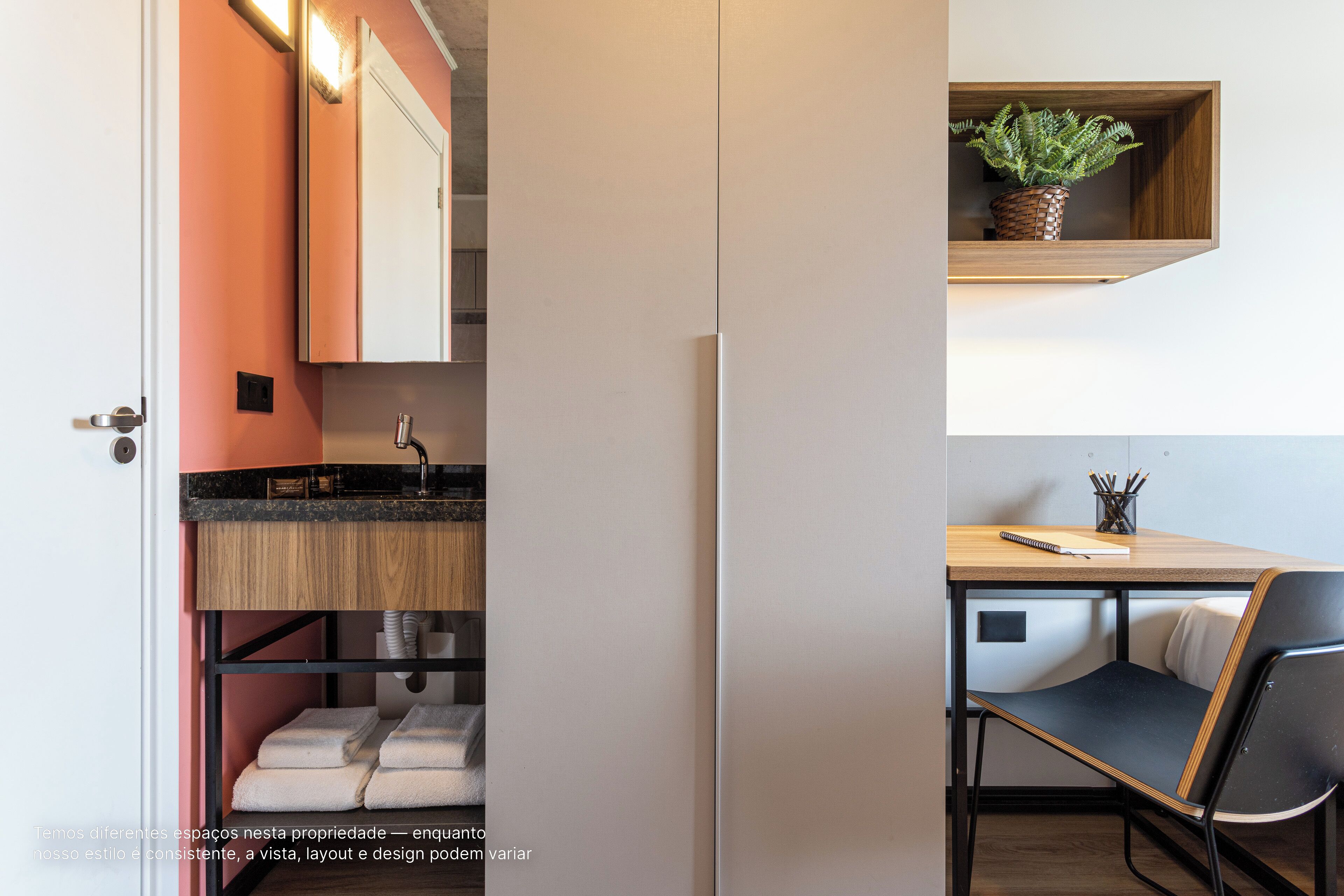 A compact kitchen with a sink, countertop, and storage cabinets.