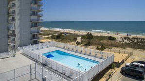 A rooftop pool with a view of the beach and ocean. - Sea Terrace 88th St, Outdoor Pool, Oceanfront building & View, *FREE Linen Pkg* (Ocean City)