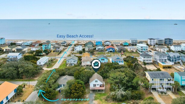 A coastal residential area with houses and easy beach access.