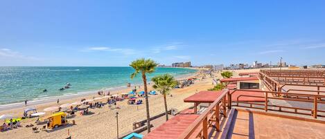 On the beach, sun-loungers, beach towels