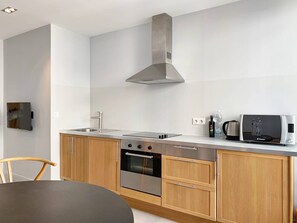 Fridge, coffee/tea maker, cookware/dishes/utensils
